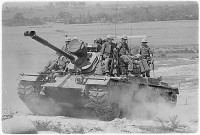 Marines of E Company, 2nd Battalion, 3rd Marines, riding on an M48A3 tank, Vietnam, 1966.gif