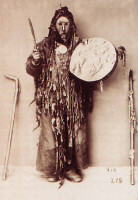 shaman_in_ritual_costume_with_tambourine.jpg