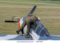 stock-photo-pilot-entering-plane-3947353.jpg