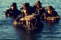 Navy_SEALs_comming_out_of_water.JPEG