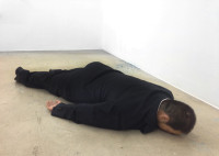 he-xiangyu-sculpts-ai-weiwei-face-down-on-the-floo.jpg