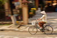 vietnamese-woman-riding-a-bicycle-panya-jampatong.jpg