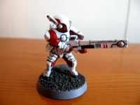 Fire_Warrior_model_white_and_red_on_a_wooden_table.jpg