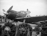 Captured_A6M5_with_engines_on_Saipan_1944.jpeg